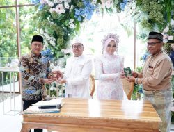 Pj. Bupati Kampar Hadiri Sekaligus Menjadi Saksi Akad Nikah Putri Bapak H. Alamsyah dengan Putra Bapak H. Afrizal