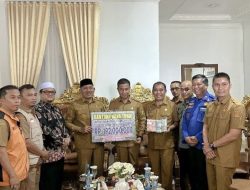 Pemda Kampar Salurkan Donasi Tunai untuk Korban Bencana di Kabupaten Lima Puluh Kota